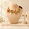 Kundal Meenakari necklace set on wooden dummy with logo and highlights