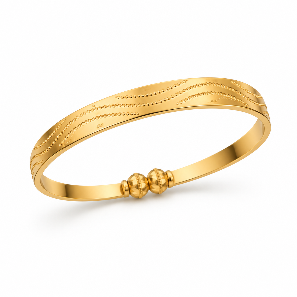 Single gold-tone wave kada on a white background