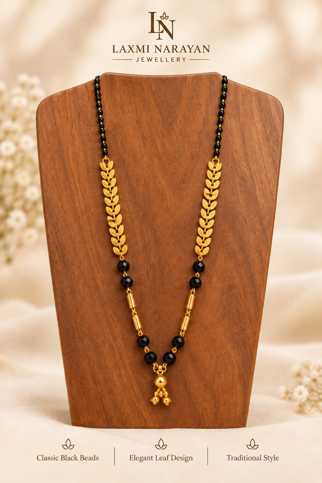 Two-ghungru leaf design mangalsutra on wooden display
